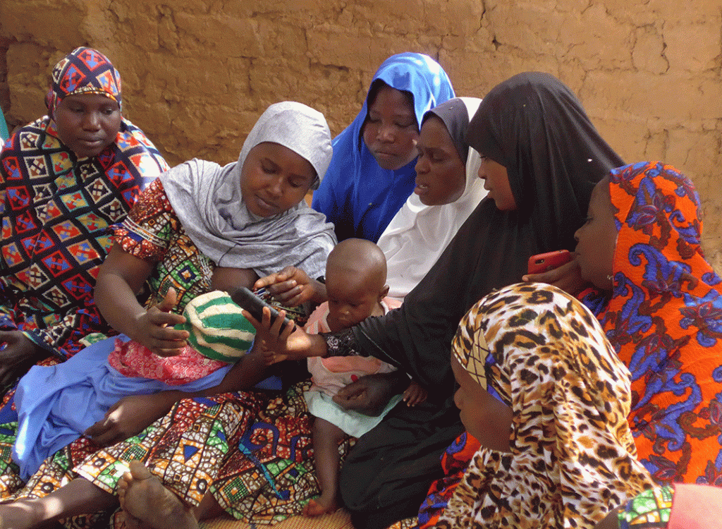 Niger village women looking at the hiveonline prototype