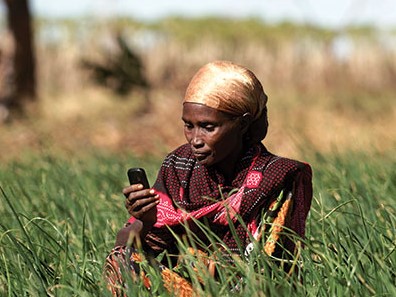 woman farmer checking phone